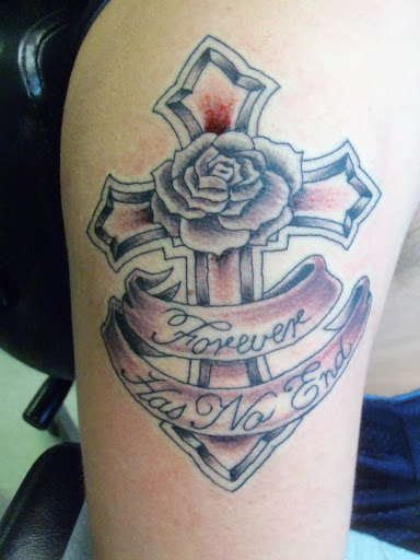 Explore rose vine tattoo ideas, creative tattoo ideas in Pelham, available at Tattoo Fever