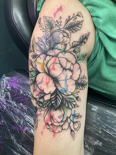 Find tattoo ideas for breast for your next unique tattoo in Mineola at Kiss of Death Ink