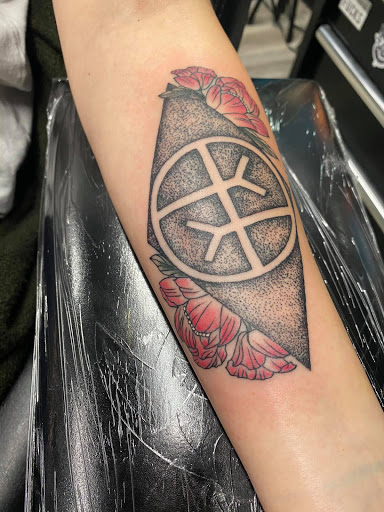 Explore dog tattoo ideas for men, creative tattoo ideas in Utica, available at Watchtower Tattoo Company