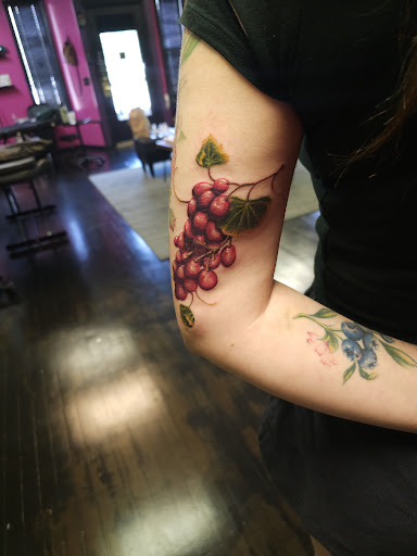 Explore tomahawk tattoo ideas, creative tattoo ideas in Toledo, available at HEYBABE Tattoo Studio