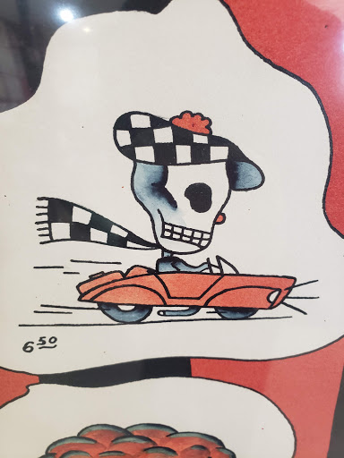 Explore red tattoo ideas women, creative tattoo ideas in Kansas City, available at Grimm Tattoo and Bert Grimm Museum