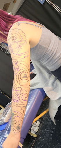 Explore behind neck tattoo ideas, creative tattoo ideas in Englewood, available at The Original Big Daddy Tattoo & Body Piercing est.1997 est.1997