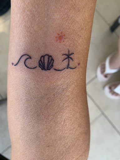 Explore dainty flower tattoo ideas, creative tattoo ideas in Bradenton, available at Memory Lane Tattoo Co.