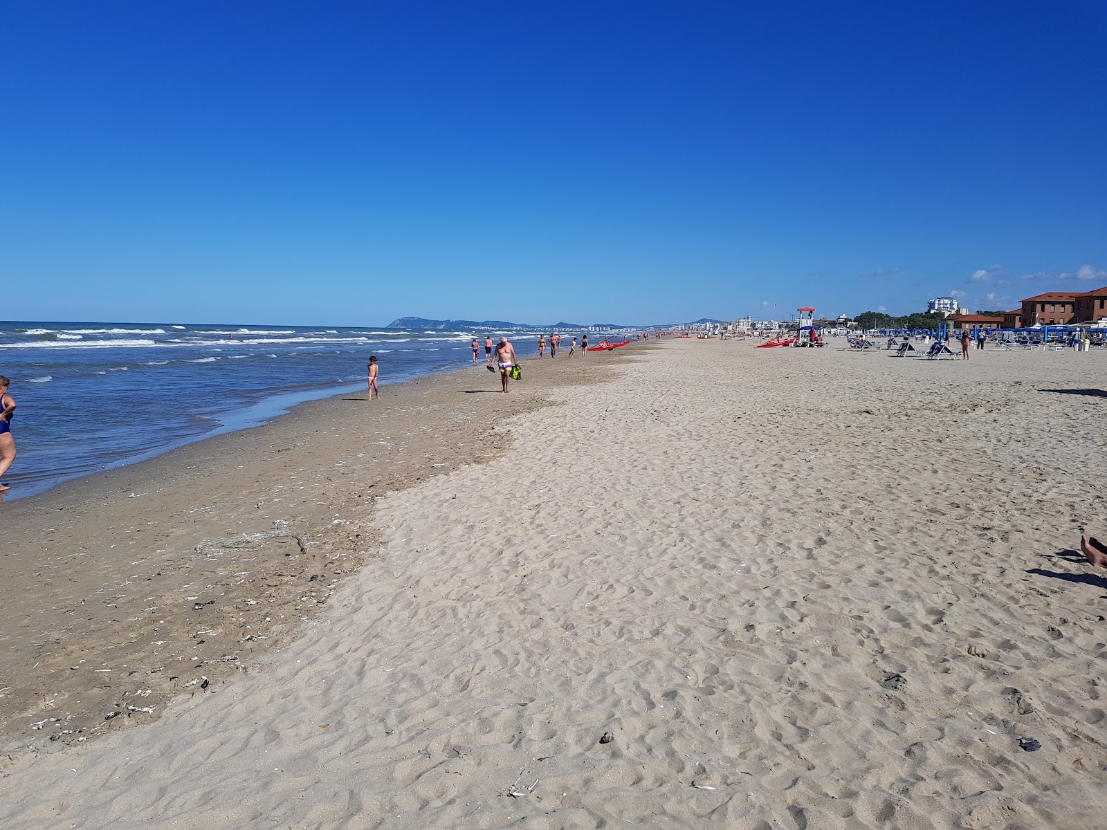 Foto van Rimini Miramare met helder zand oppervlakte
