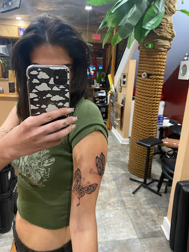 Explore twin tattoo ideas for mom, creative tattoo ideas in Philadelphia, available at No Ka Oi Tiki Tattoo