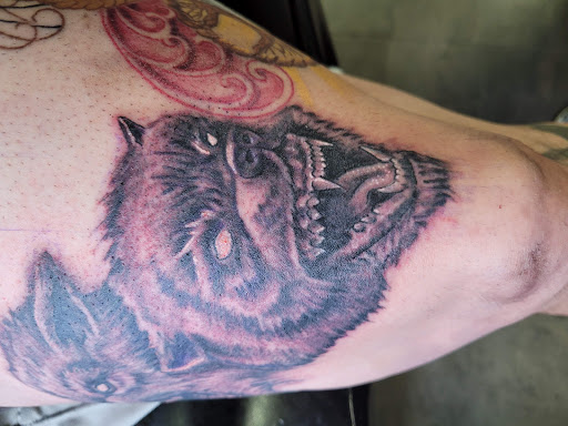 Find tattoo ideas of roses for your next unique tattoo in Las Vegas at Work of Art Tattoo and Piercing