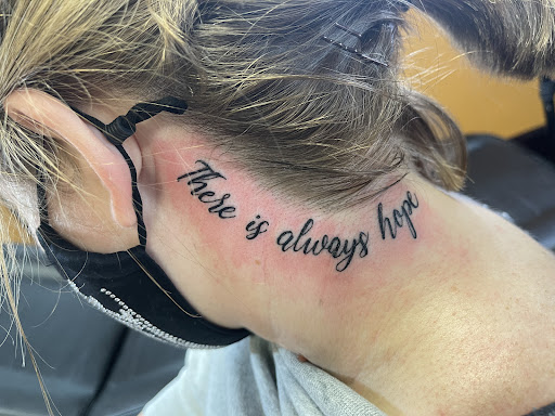 Explore hairline tattoo ideas, creative tattoo ideas in Canton, available at The Inkeepers Tattoo Parlor