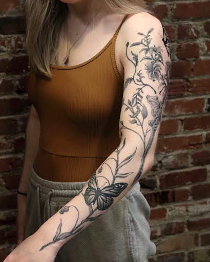 Explore blackout tattoo ideas, creative tattoo ideas in Spokane, available at Fortunata Tattoo Studio