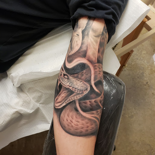 Explore cool guitar tattoo ideas, creative tattoo ideas in Tea, available at Red Arbor Tattoo