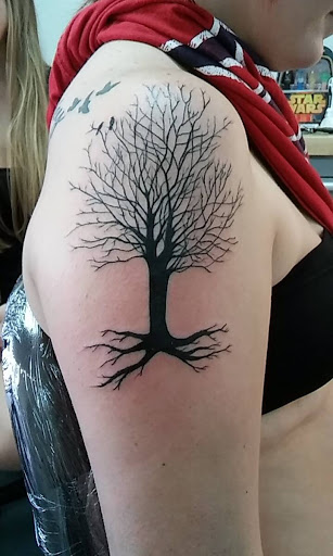 Explore wolf neck tattoo ideas, creative tattoo ideas in Fort Myers, available at Tiger Lotus Tattoo and Piercing