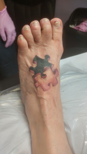 Explore man face tattoo ideas, creative tattoo ideas in Sanford, available at Venom Ink Tattoo