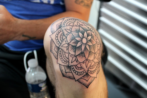 Explore pulp fiction tattoo ideas, creative tattoo ideas in Fort Myers, available at Tiger Lotus Tattoo and Piercing