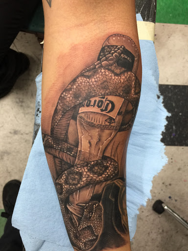 Explore bone tattoo ideas, creative tattoo ideas in Lawton, available at Impact Ink Tattoo Studios