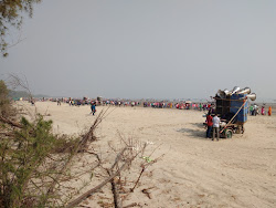 Zdjęcie Gobardhanpur Beach z powierzchnią turkusowa czysta woda