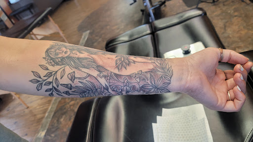 Explore black power tattoo ideas, creative tattoo ideas in Omaha, available at Eternal Tattoo & Body Piercing - Omaha