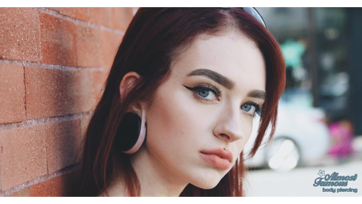 Explore mens upper back tattoo ideas, creative tattoo ideas in Minneapolis, available at Almost Famous Body Piercing