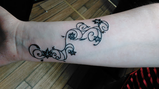 Explore twin daughter tattoo ideas, creative tattoo ideas in Newport, available at T N T Explosive Tattoo