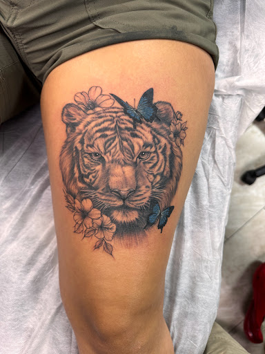 Explore christmas tree tattoo ideas, creative tattoo ideas in New Baltimore, available at petra tattoo