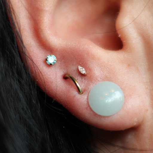 Explore emerald tattoo ideas, creative tattoo ideas in Toledo, available at Piercings by Caitlin presents Holier Toledo