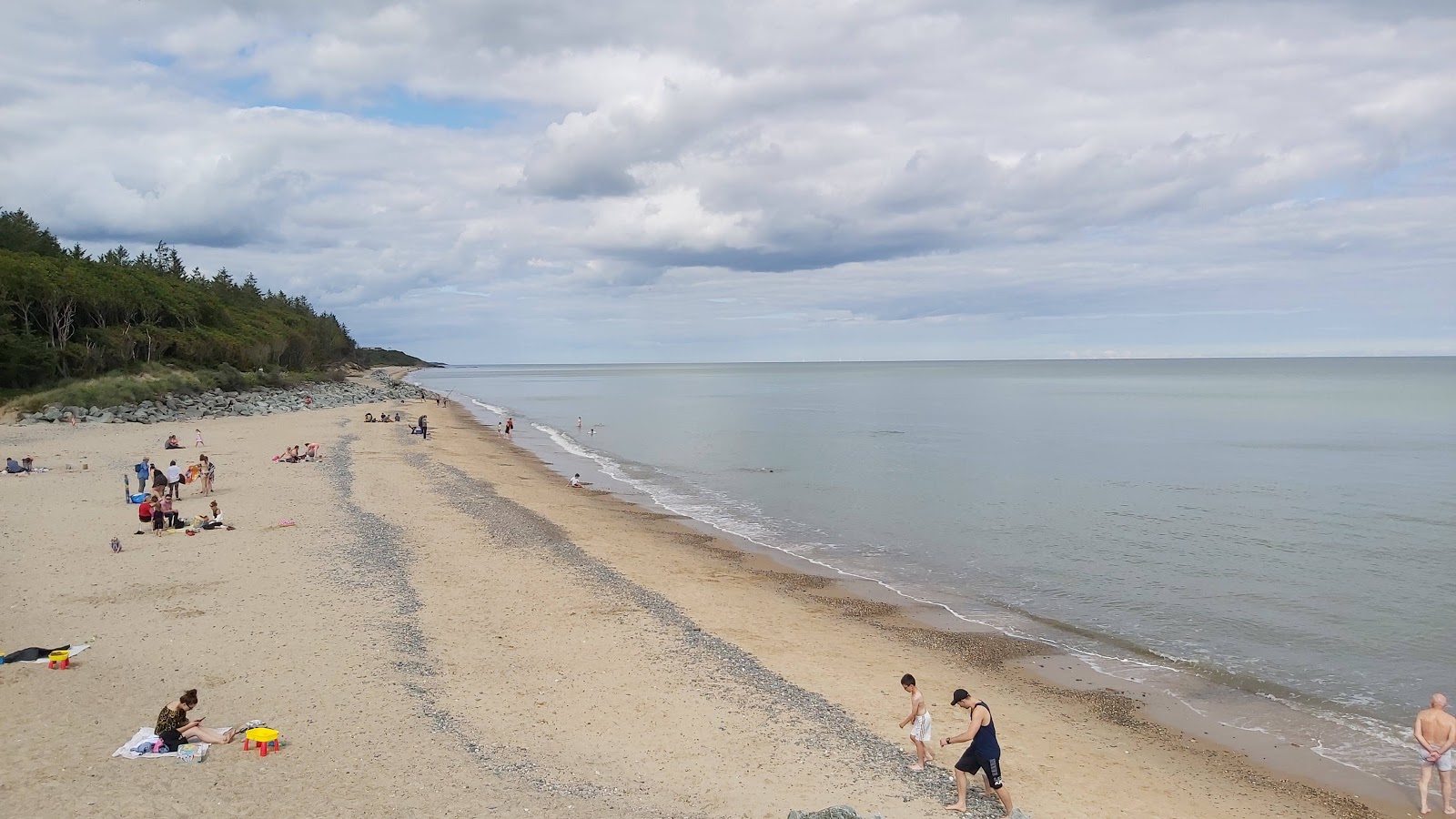 Foto di Kiltennell Bay Beach con una superficie del sabbia beige e ciottoli