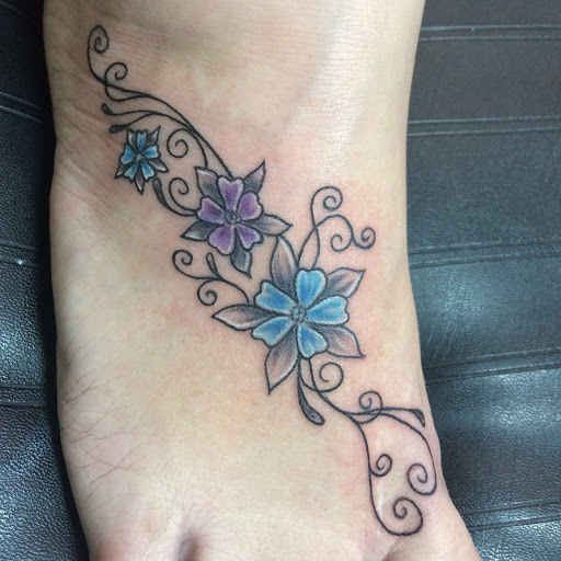 Explore men's back shoulder tattoo ideas, creative tattoo ideas in Goshen, available at Lady Luck Studio