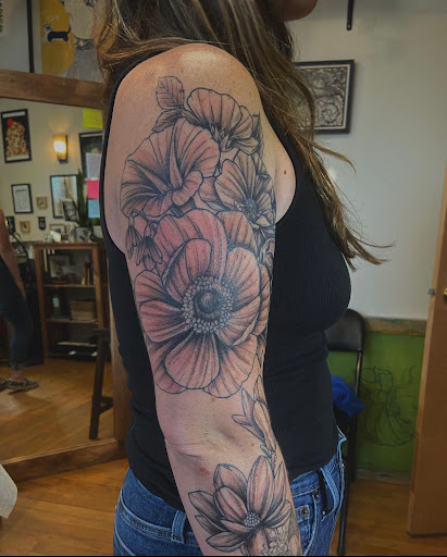 Explore tattoo ideas for shoulder woman, creative tattoo ideas in Albany, available at Dead Presidents Lounge