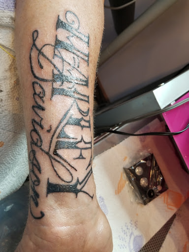 Explore hand tattoo cover up ideas, creative tattoo ideas in Davis, available at SIX GUN SOUND TATTOO