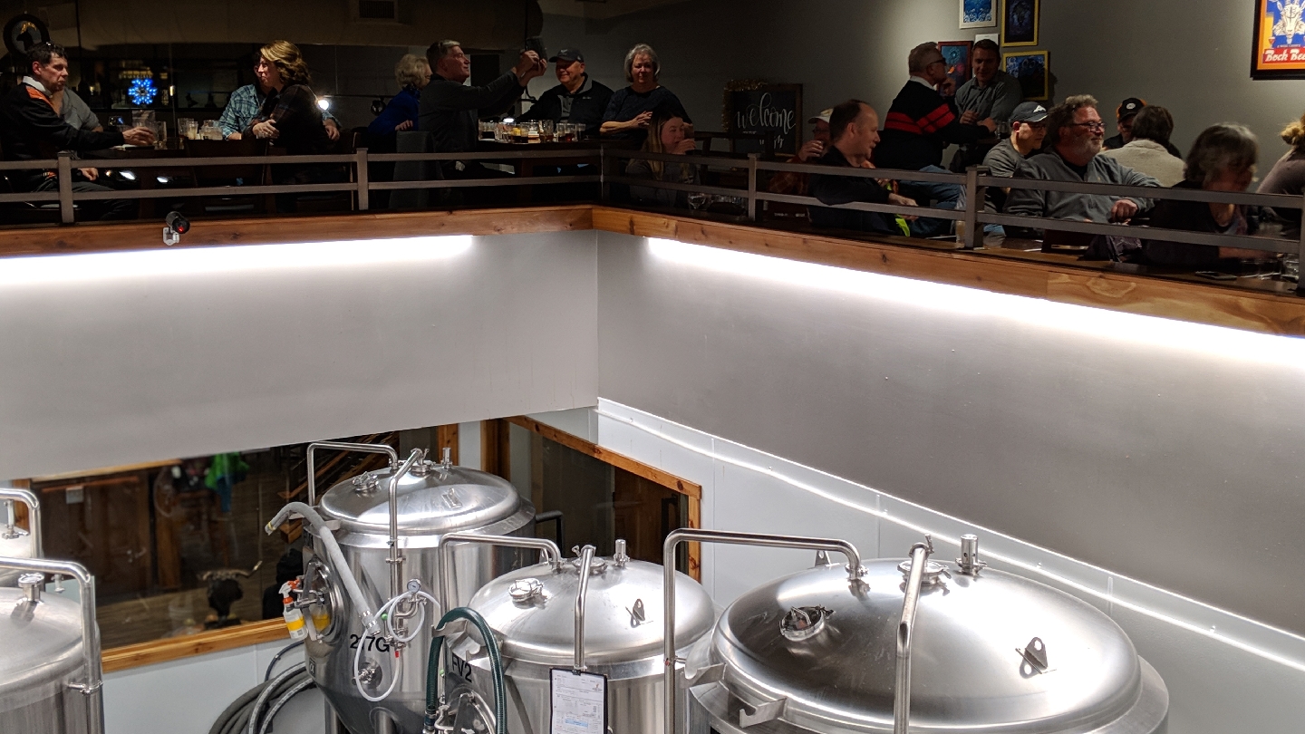 Beer taps lined up on a bar