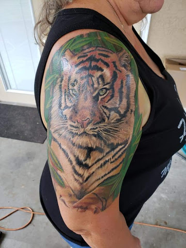 Explore tattoo ideas for a submissive, creative tattoo ideas in Ocoee, available at Slaughterized Ink Tattoo and Piercing Studio