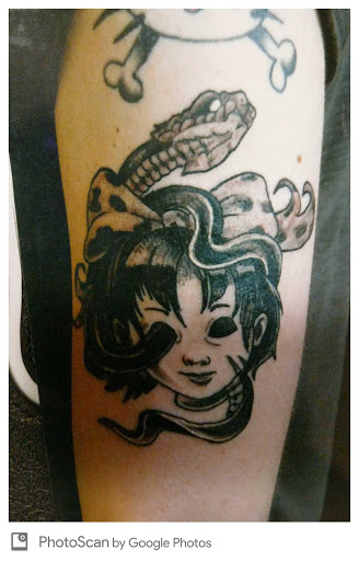 Explore red bird tattoo ideas, creative tattoo ideas in Charlotte, available at Crown Custom Tattoo Studios