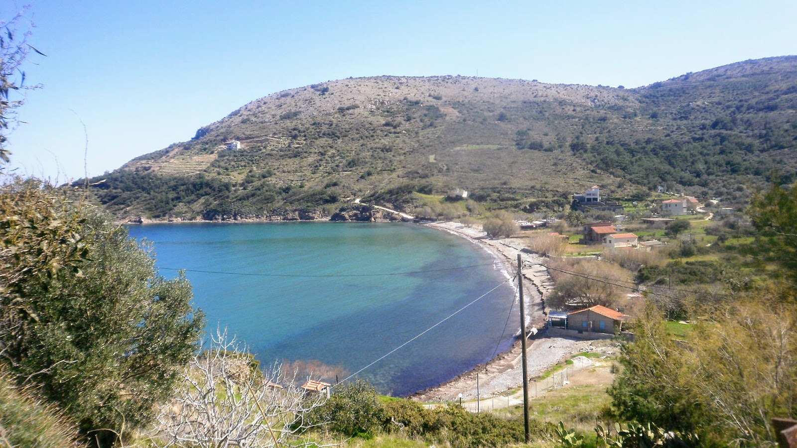 Foto av Vlychada beach med lätt sten yta