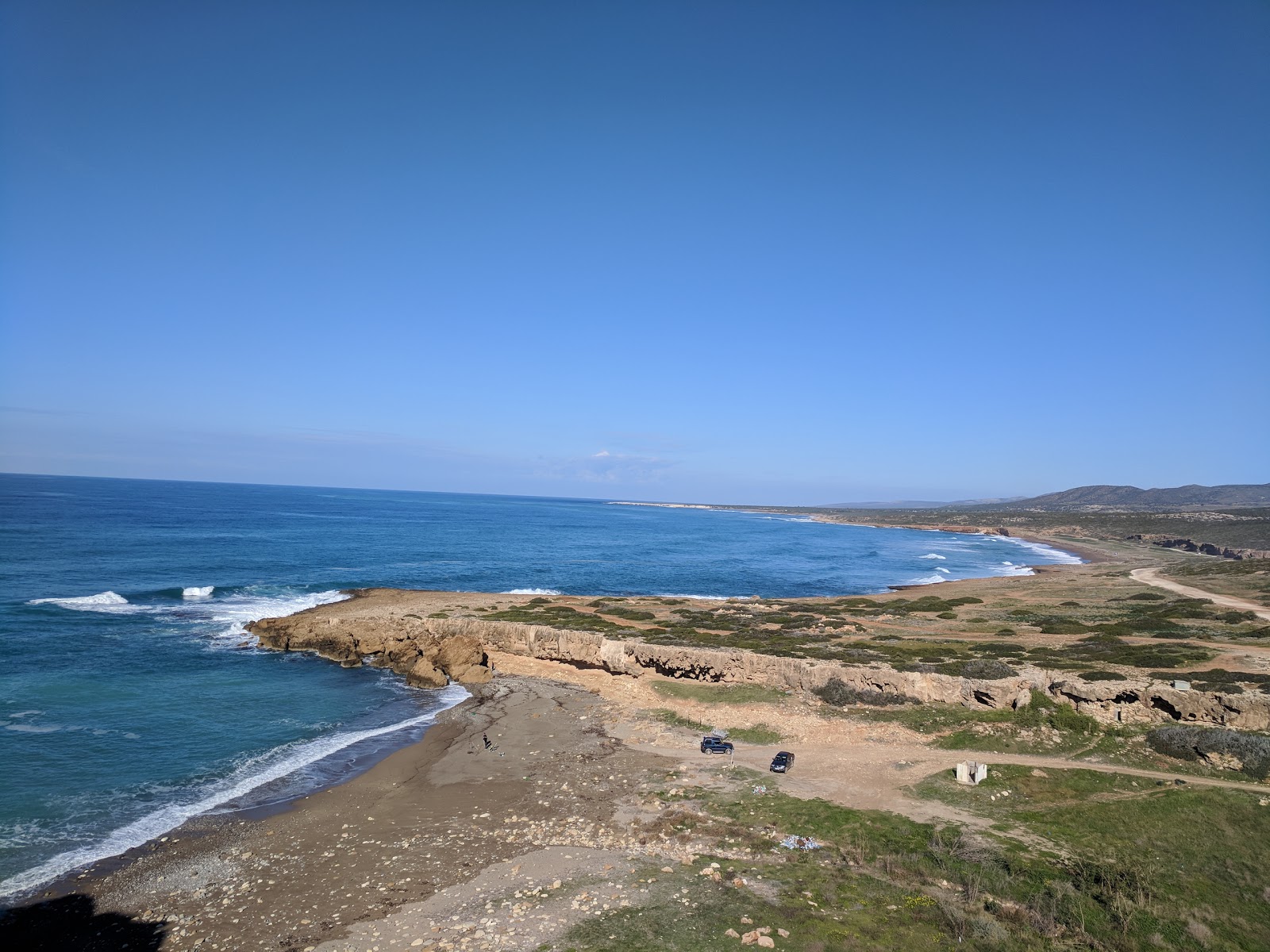 Foto di Toxeftra beach II con una superficie del sabbia marrone