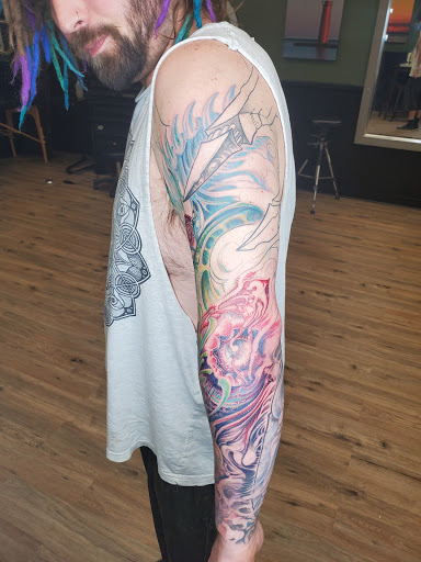 Explore trinity tattoo ideas, creative tattoo ideas in Grandville, available at Lighthouse Tattoo Company