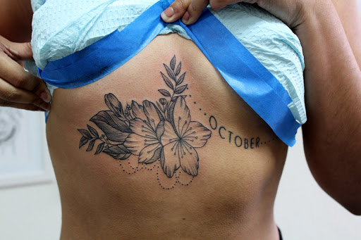 Explore strength tattoo ideas for females, creative tattoo ideas in Fort Myers, available at Tiger Lotus Tattoo and Piercing