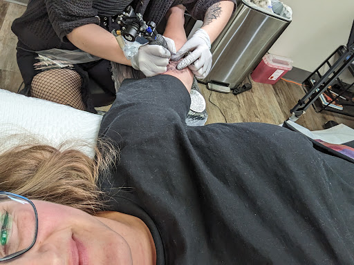 Find necklace tattoo ideas for your next unique tattoo in Omaha at Ironwood Ink