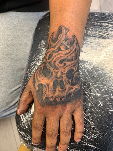 Explore cover up tattoo ideas on hand, creative tattoo ideas in Gadsden, available at Zekez Inkz Tattoos & Piercings