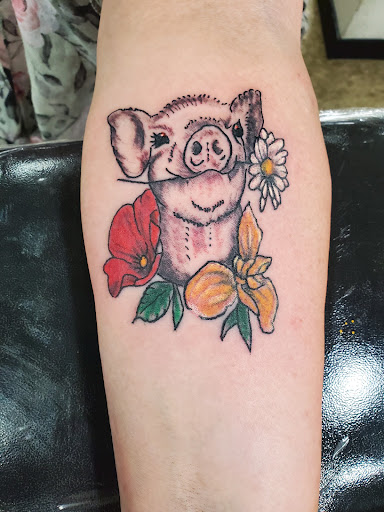 Explore cute dog tattoos ideas, creative tattoo ideas in Sturgis, available at The Tattoo Cellar