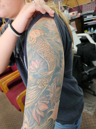 Explore fish tattoo ideas for men, creative tattoo ideas in Angola, available at Hoodlum Ink