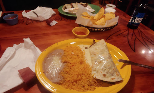 Chabley steak tacos in the back w/ a side of sour cream and s/o jalapenos. Pictured up front is the burrito with steak, onions, peppers, tomatoes. (Usually topped with shredded melted cheese but I exchanged for cheese sauce.) With beans and rice. Steak was especially delicious!