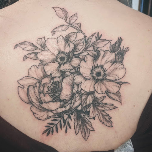 Explore peacock feather tattoo ideas, creative tattoo ideas in Charlotte, available at Canvas Tattoo & Art Gallery