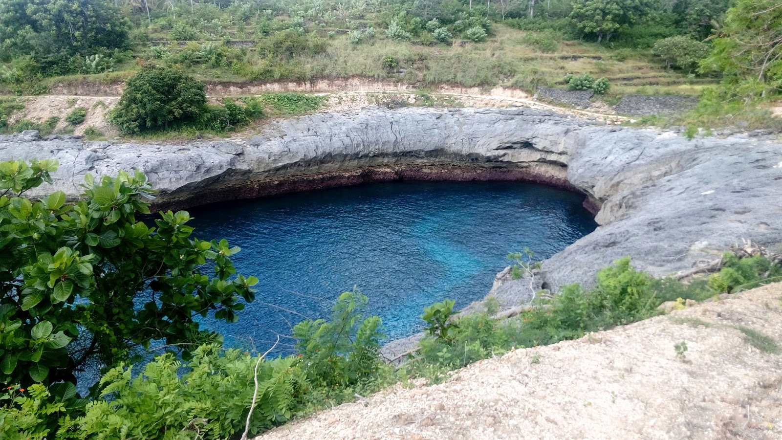 Foto de Pagede Beach con terreno rocoso superficie