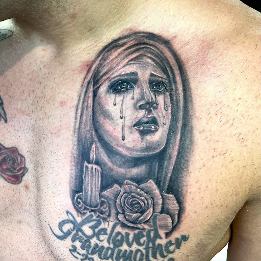 Explore lower back tattoo ideas for men, creative tattoo ideas in Goshen, available at Lady Luck Studio