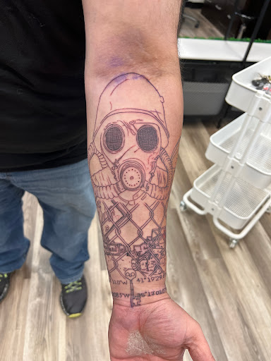 Explore dirtbike tattoo idea, creative tattoo ideas in Monroe, available at Rebel Tattoo