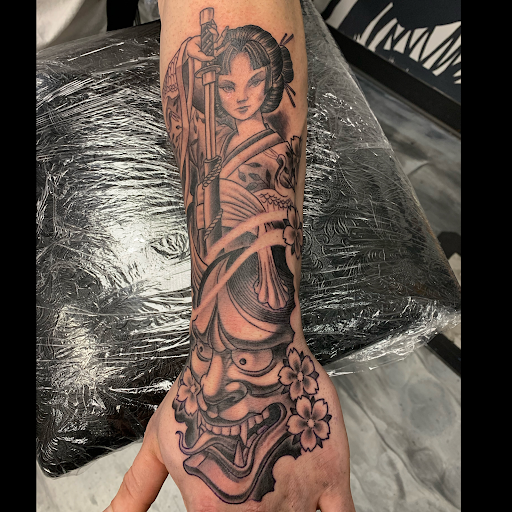 Explore ideas for spine tattoos, creative tattoo ideas in Fayetteville, available at Sacred Raven Tattoo Shop