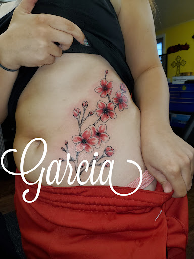 Explore arm sleeve tattoo ideas woman, creative tattoo ideas in Kearney, available at Ink Shop Tattoos & Piercings