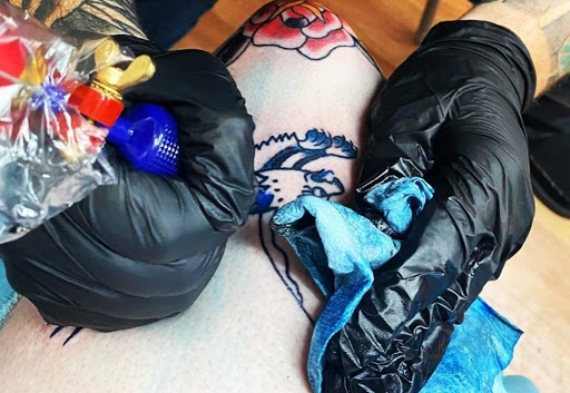 Explore name cover up tattoo ideas, creative tattoo ideas in Benton, available at Spectrum Tattoo