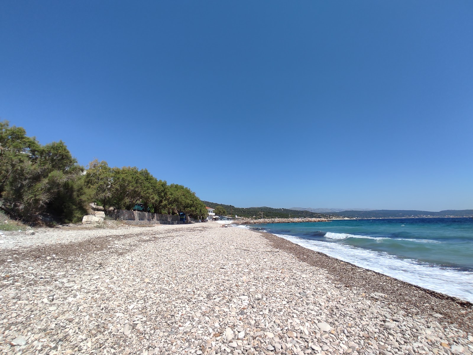 Photo of Paralia Vokaria with blue pure water surface