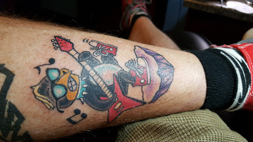 Explore mental health ribbon tattoo ideas, creative tattoo ideas in Mandeville, available at Turning Point Tattoos