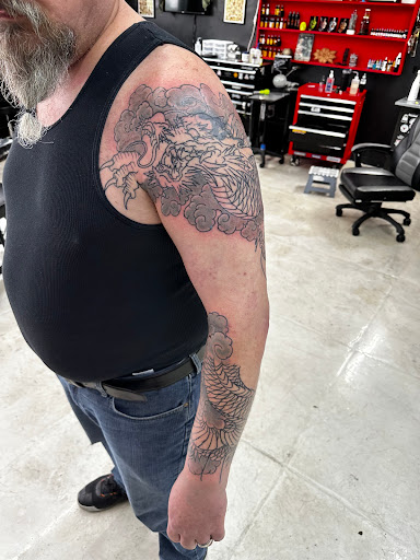 Explore cover up tattoo ideas male chest, creative tattoo ideas in Girard, available at Cult Tattoo