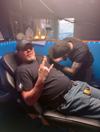 Explore calf tattoo ideas for men, creative tattoo ideas in Chattanooga, available at The Sailors Den Tattoos and Piercing & The Scurvy Pearl Music Venue